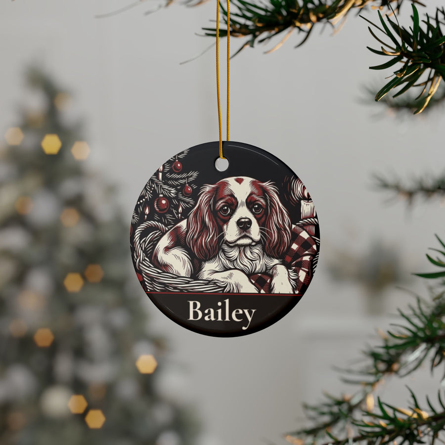 Personalized Cavalier King Charles Spaniel Christmas ornament hanging on a Christmas tree, shown with the sample name Bailey