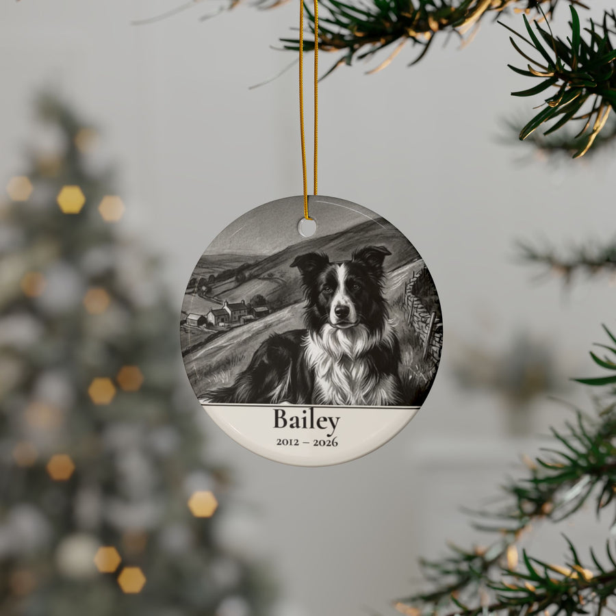 Personalized Border Collie memorial ornament hanging on a Christmas tree, shown with the sample name Bailey