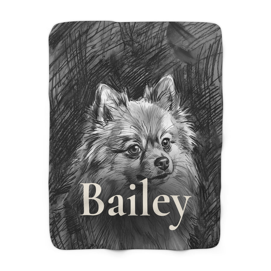 Personalized Pomeranian sherpa fleece blanket, charcoal-style portrait with the dog's name across the lower part