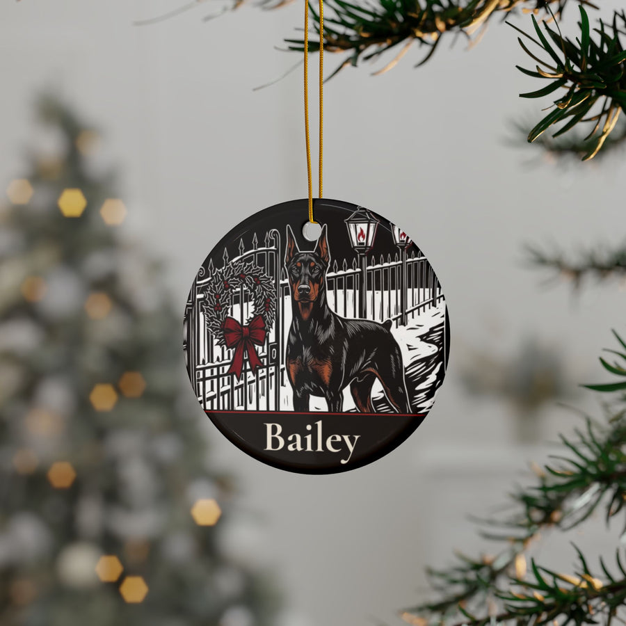 Personalized Doberman Christmas ornament hanging on a Christmas tree, shown with the sample name Bailey