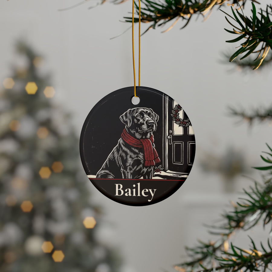 Personalized Labrador Retriever Christmas ornament hanging on a Christmas tree, shown with the sample name Bailey