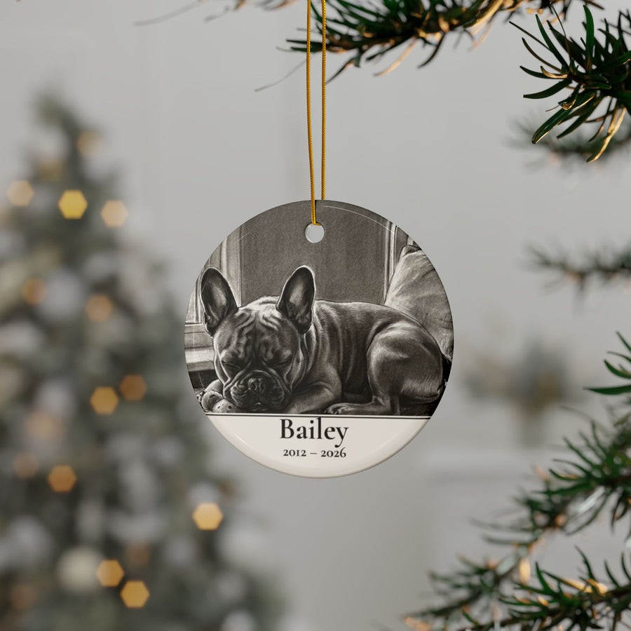 Personalized French Bulldog memorial ornament hanging on a Christmas tree, shown with the sample name Bailey