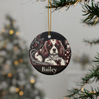 Personalized Cavalier King Charles Spaniel Christmas ornament hanging on a Christmas tree, shown with the sample name Bailey