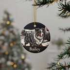Personalized Australian Shepherd Christmas ornament hanging on a Christmas tree, shown with the sample name Bailey
