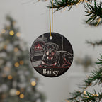 Personalized Rottweiler Christmas ornament hanging on a Christmas tree, shown with the sample name Bailey