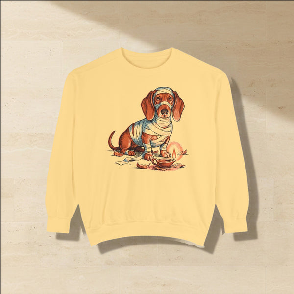 Dachshund Halloween Sweatshirt laid flat on a warm limestone surface, shot from overhead