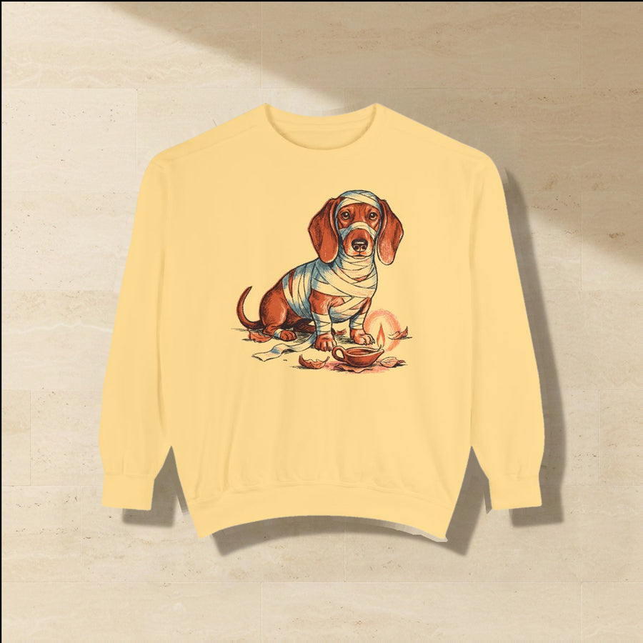 Dachshund Halloween Sweatshirt laid flat on a warm limestone surface, shot from overhead