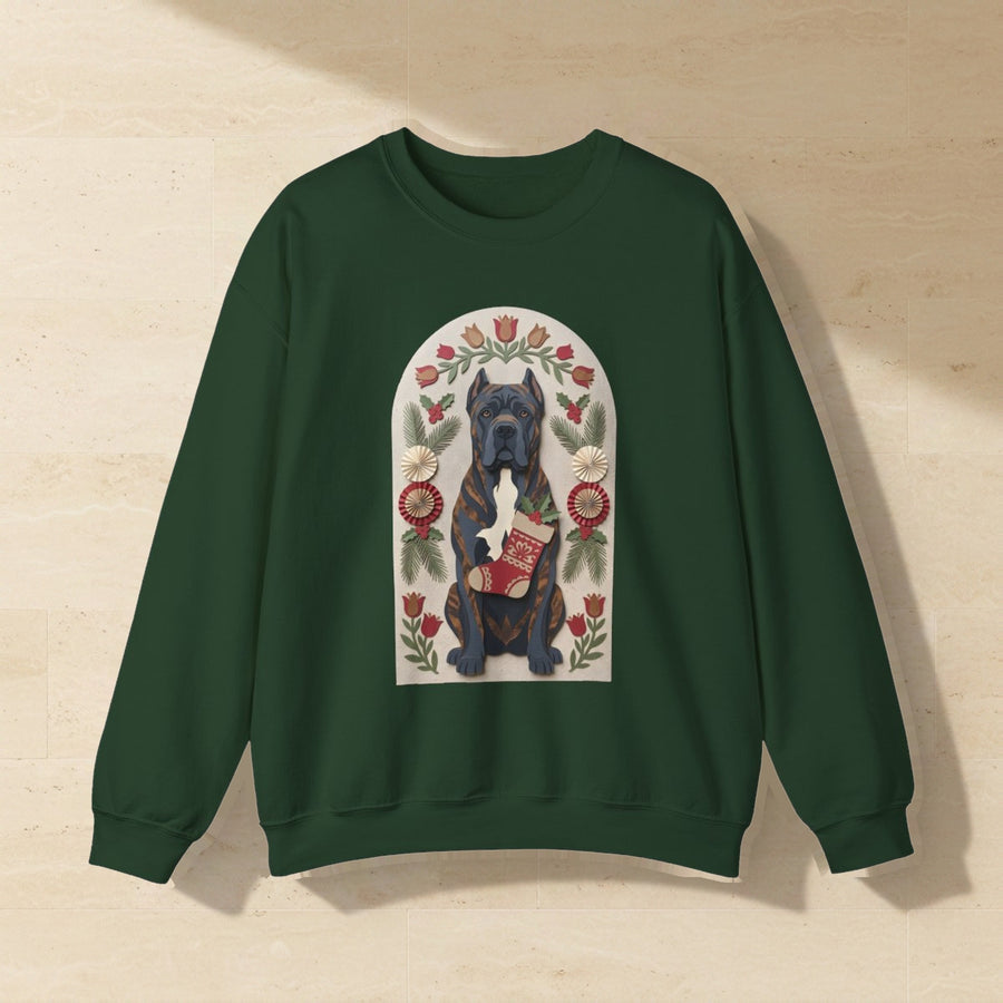 Cane Corso Folk Paper-Cut Christmas Crewneck Sweatshirt, Wycinanki Style Holiday Dog Art, Cane Corso Lover Gift laid flat on a warm limestone surface, shot from overhead