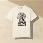 Dachshund Woodcut Art Shirt laid flat on a warm limestone surface, shot from overhead