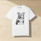 Border Collie Woodcut Shirt laid flat on a warm limestone surface, shot from overhead