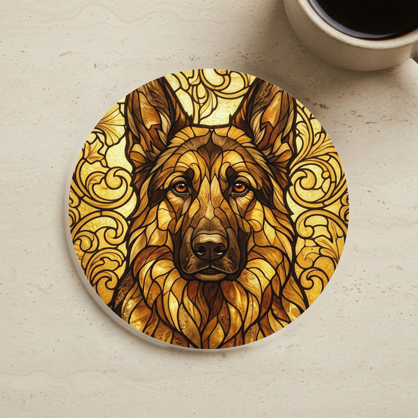 German Shepherd Stained Glass Monochrome Gold Cork Back Coaster cork coaster shown on a warm limestone surface beside a mug