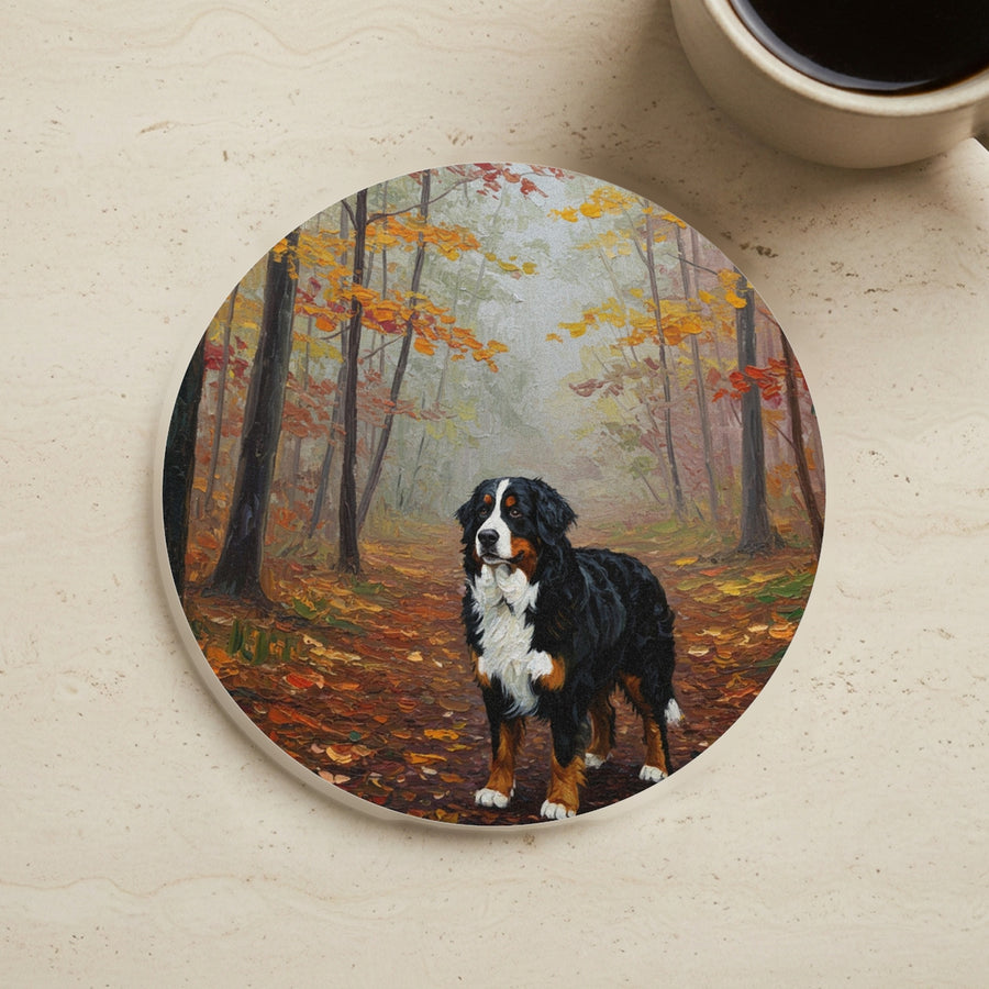 Acrylic Painting Bernese Mountain Dog - Autumn Woods cork coaster shown on a warm limestone surface beside a mug