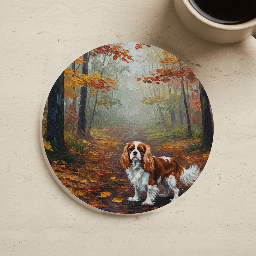 Acrylic Painting Cavalier King Charles Spaniel - Autumn Woods cork coaster shown on a warm limestone surface beside a mug