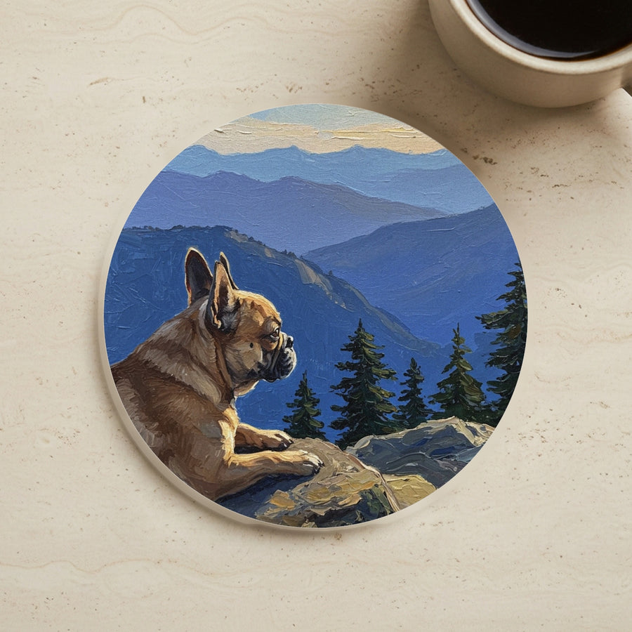 Acrylic Painting French Bulldog - Mountain Overlook cork coaster shown on a warm limestone surface beside a mug