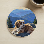 Acrylic Painting Havanese - Mountain Overlook cork coaster shown on a warm limestone surface beside a mug