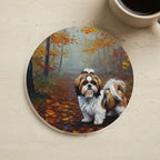 Acrylic Painting Shih Tzu - Autumn Woods cork coaster shown on a warm limestone surface beside a mug