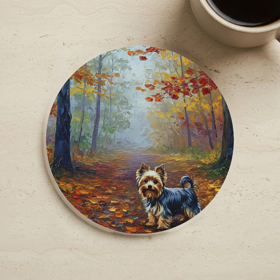 Acrylic Painting Yorkshire Terrier - Autumn Woods cork coaster shown on a warm limestone surface beside a mug