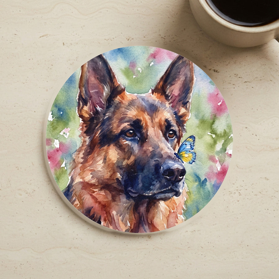 German Shepherd Watercolor Butterfly Bloom Drink Coaster cork coaster shown on a warm limestone surface beside a mug