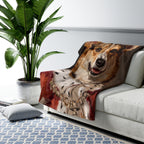 Corgi Kings & Queens sherpa blanket by Tritan, on sofa