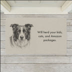 Border Collie Doormat shown flat on a pale painted porch outside a white front door
