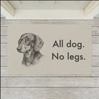 Dachshund Doormat shown flat on a pale painted porch outside a white front door