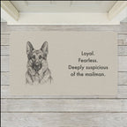German Shepherd Doormat shown flat on a pale painted porch outside a white front door