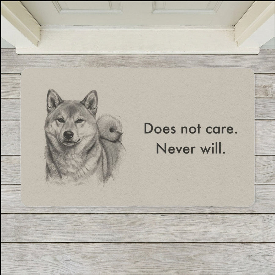 Shiba Inu Doormat shown flat on a pale painted porch outside a white front door