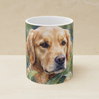 Golden Retriever Watercolor Garden Peek Ceramic Mug 11oz shown on a warm limestone shelf, front view