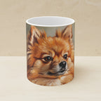 Pomeranian Oil Portrait Ceramic Mug 11oz shown on a warm limestone shelf, front view