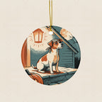 Jack Russell Terrier Halloween Poster Ceramic Tree Ornament round ceramic ornament by Tritan, laid flat on a warm limestone surface