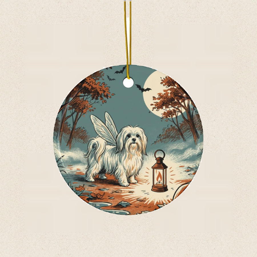Maltese Halloween Poster Ceramic Tree Ornament round ceramic ornament by Tritan, laid flat on a warm limestone surface