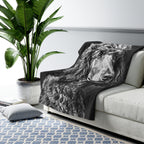 Poodle Charcoal sherpa blanket by Tritan, on sofa