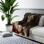 Poodle Kings & Queens sherpa blanket by Tritan, on sofa