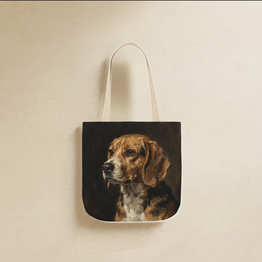 Beagle Tote Bag canvas tote bag hanging by its handles against a warm limestone wall