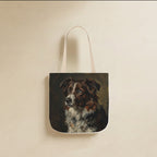 Border Collie Tote Bag canvas tote bag hanging by its handles against a warm limestone wall