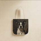 Boston Terrier Tote Bag canvas tote bag hanging by its handles against a warm limestone wall