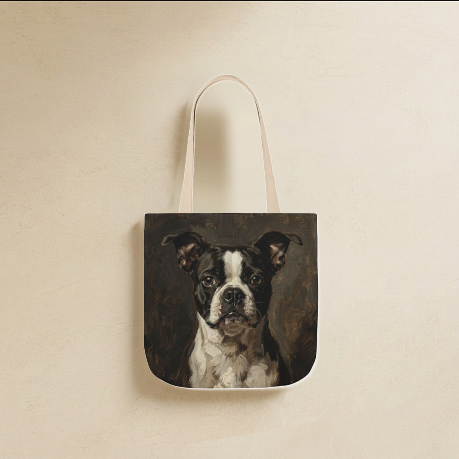 Boston Terrier Tote Bag canvas tote bag hanging by its handles against a warm limestone wall