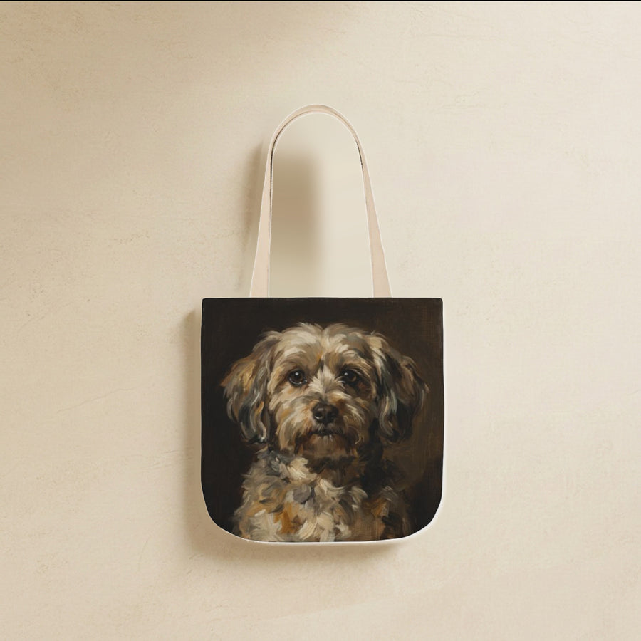 Havanese Tote Bag canvas tote bag hanging by its handles against a warm limestone wall