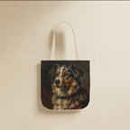 Australian Shepherd Tote Bag canvas tote bag hanging by its handles against a warm limestone wall