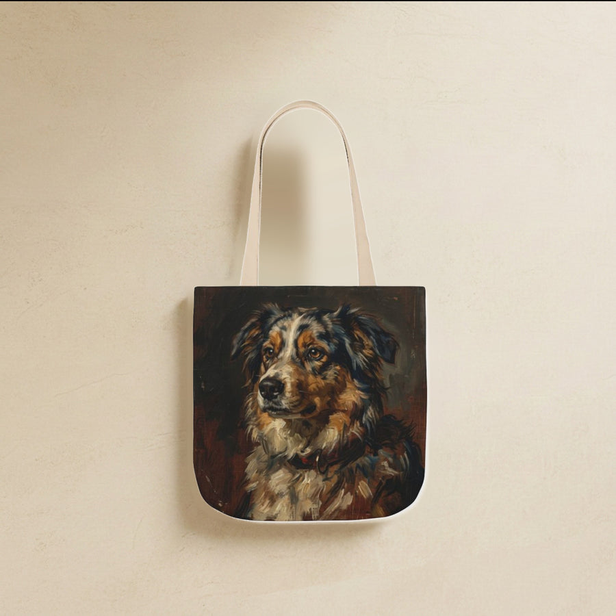 Australian Shepherd Tote Bag canvas tote bag hanging by its handles against a warm limestone wall