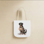 Labrador Halloween Tote Bag canvas tote bag hanging by its handles against a warm limestone wall