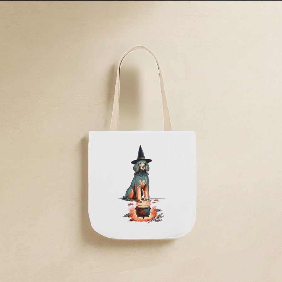 Poodle Halloween Tote Bag canvas tote bag hanging by its handles against a warm limestone wall